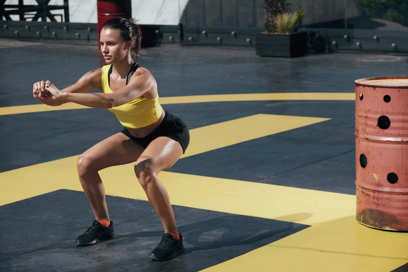 How Heel-Elevated Squats Help You Train Better, Build More Muscle, and Move With Better Form
